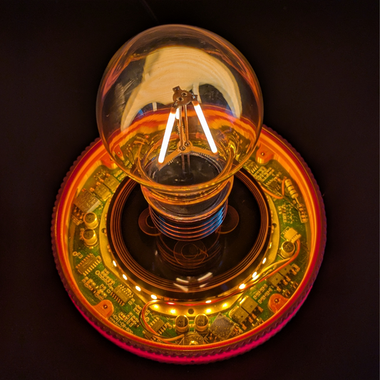 Levitating Vintage Filament Light Bulb Floating Above Glowing LED Base