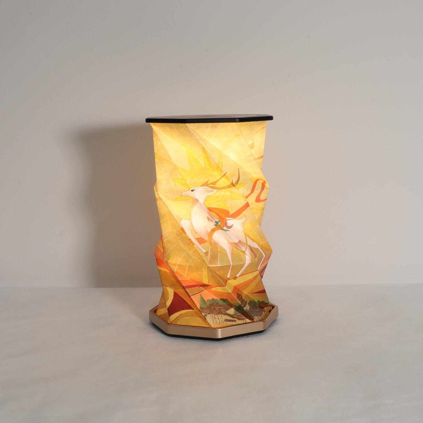 Decorative lamp with a scenic design on a plain background