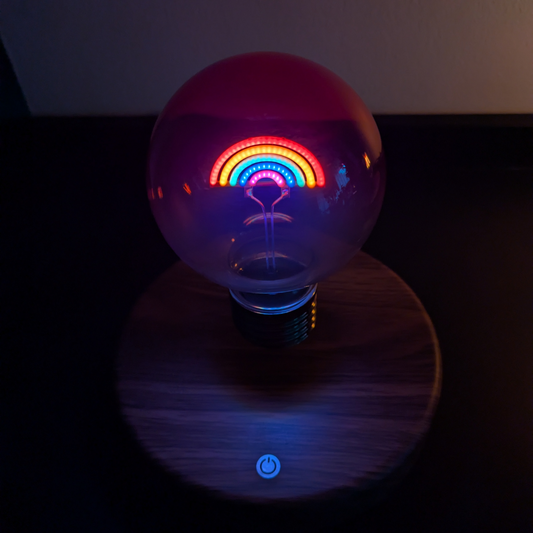 Light bulb with colorful interior design on a dark background