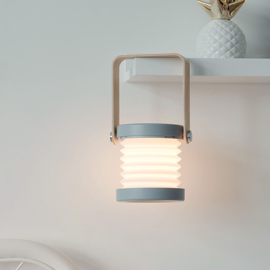 Modern wall-mounted light fixture on a neutral background