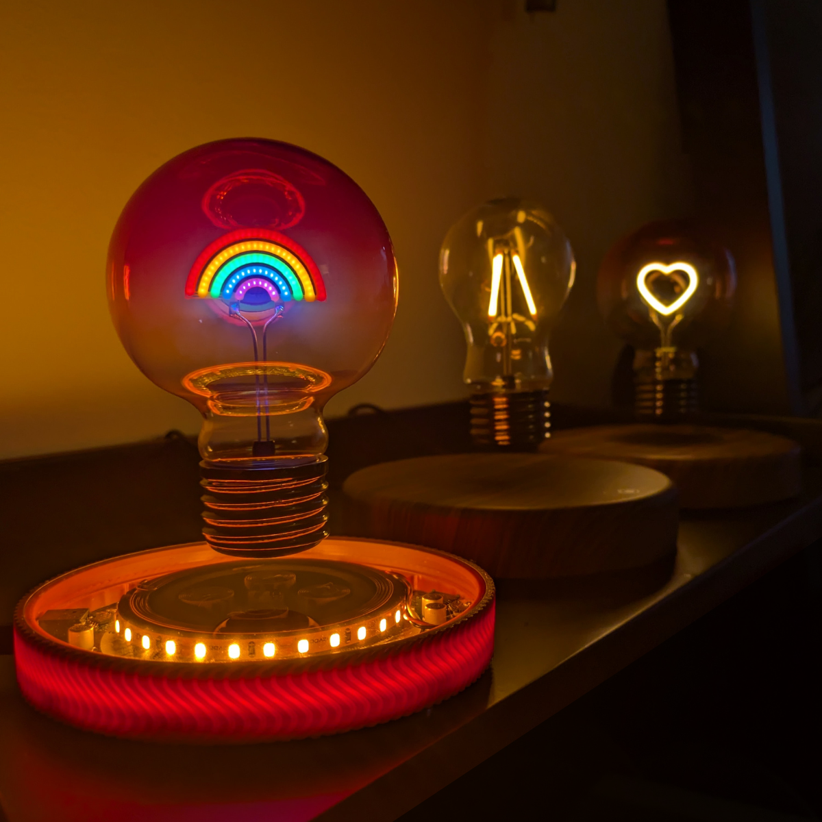 Levitating Rainbow Light Bulb Lamp Floating Above Glowing LED Base