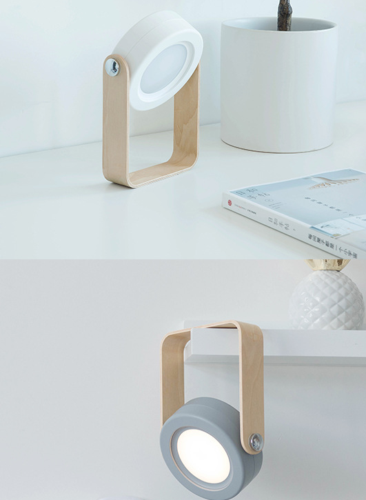 Modern table lamps with wooden accents on a white surface.