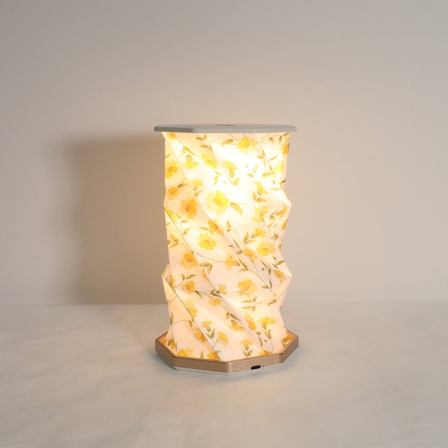 Decorative lamp with floral pattern on a plain background