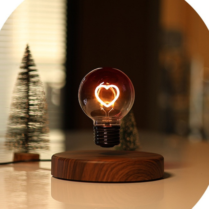 Light bulb on a wooden base with a blurred background