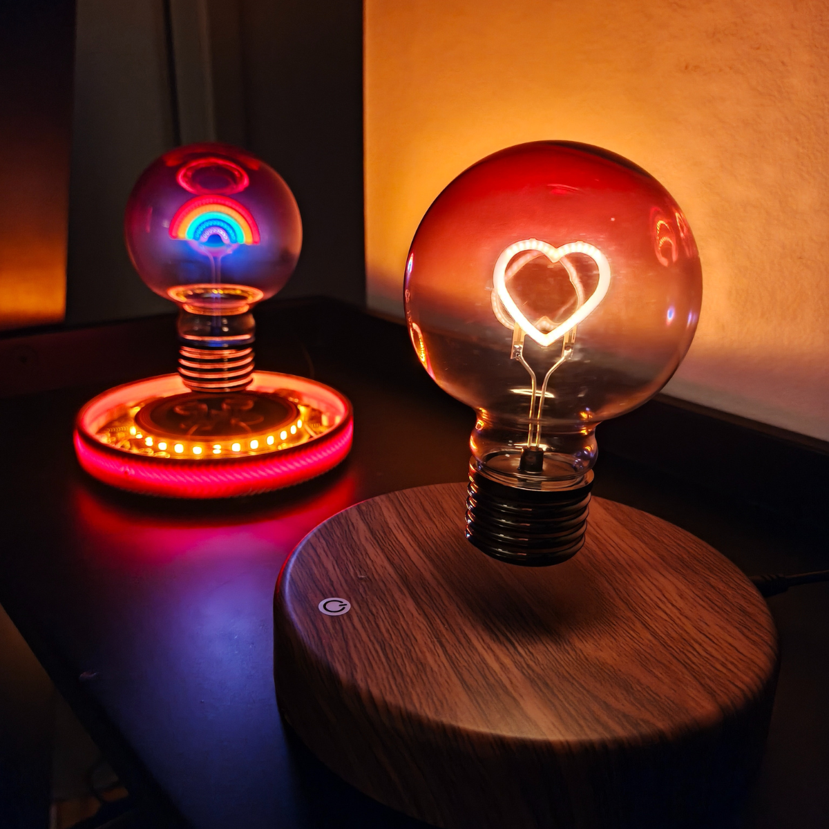 Two unique light bulbs on wooden bases with a warm glow.