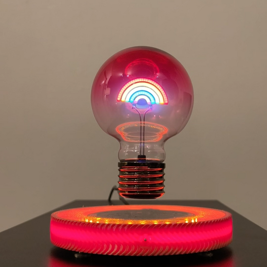 levitating rainbow LED light lamp, floating over glowing red and yellow LED base